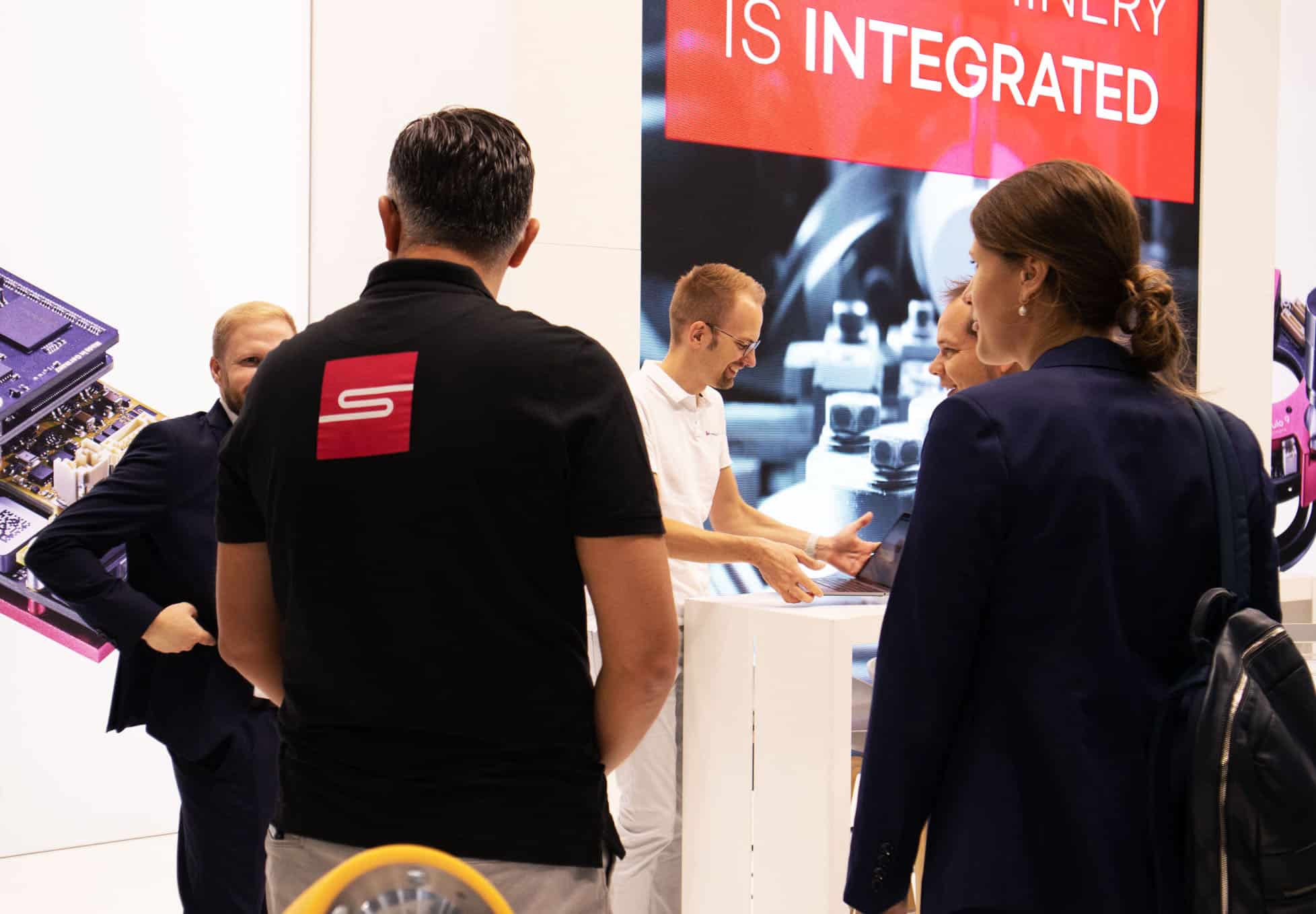 a group of people standing next to each other