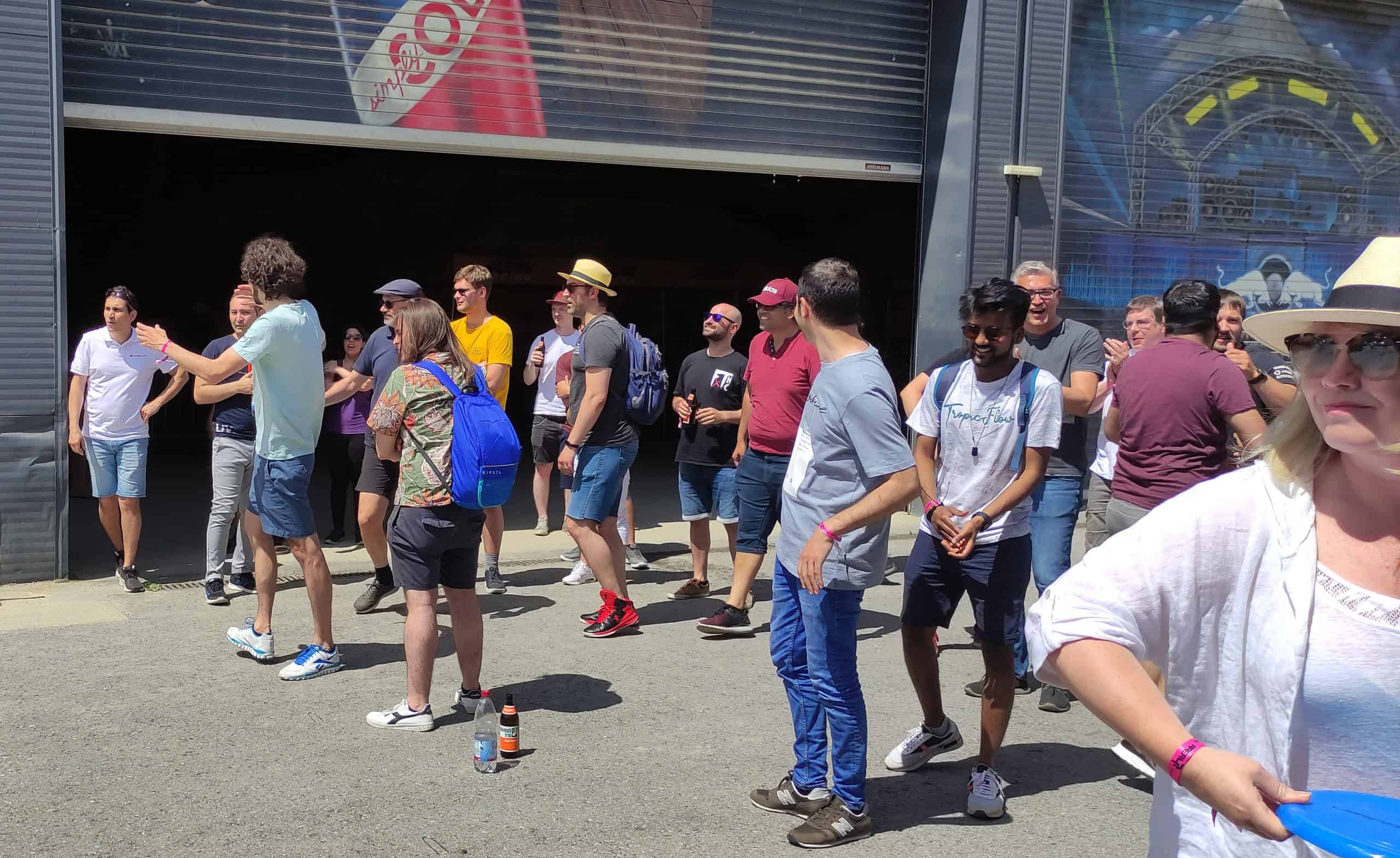 a group of people standing in front of a building